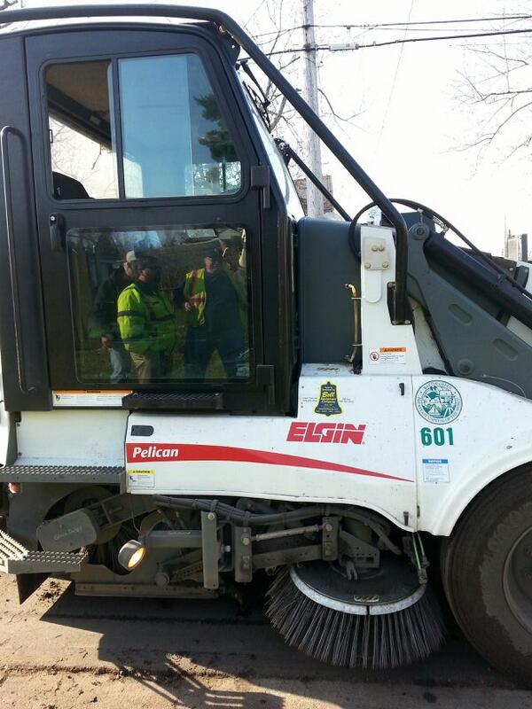 A white street sweeper