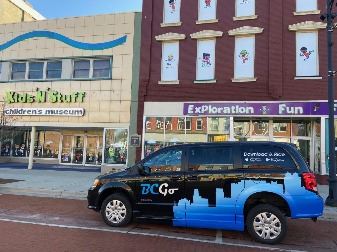 B C Go van in front of Kids and Stuff museum in Albion