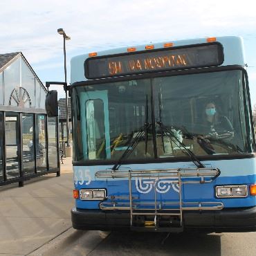 Battle Creek Transit bus stopped at a shelter at the downtown transfer center